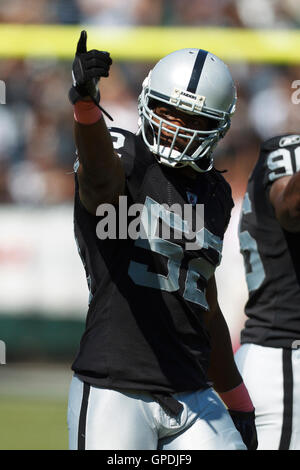 Oct 2, 2011; Oakland, CA, USA; Oakland Raiders linebacker Quentin Groves (52) enters the field before the game against the New England Patriots at O.co Coliseum. New England defeated Oakland 31-19. Stock Photo