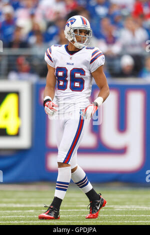 New York Giants receiver David Tyree (85) hauls in a long pass against the  New England Patriots' Rodney Harrison (37) on the game-winning drive in a  17-14 victory over the New England