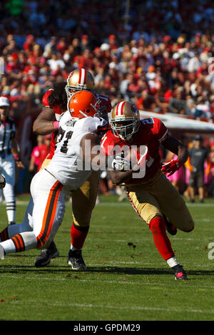 Oct 30, 2011; San Francisco, CA, USA; San Francisco 49ers running back Frank Gore (21) is tackled by Cleveland Browns defensive tackle Ahtyba Rubin (71) during the second quarter at Candlestick Park. San Francisco defeated Cleveland 20-10. Stock Photo