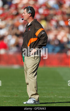 Cleveland Browns coach Pat Shurmur walks off the field with a game ball  after the Browns beat the Miami Dolphins 17-16 in an NFL football game  Sunday, Sept. 25, 2011, in Cleveland. (