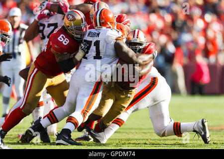 Oct 30, 2011; San Francisco, CA, USA; San Francisco 49ers running back Frank Gore (21) is tackled by Cleveland Browns defensive tackle Ahtyba Rubin (71) during the fourth quarter at Candlestick Park. San Francisco defeated Cleveland 20-10. Stock Photo