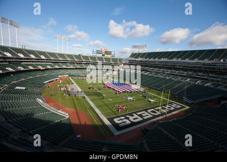 Nov 6, 2011; Oakland, CA, USA; General view of O.co Coliseum with an American flag on the field before the game between the Oakland Raiders and the Denver Broncos. Denver defeated Oakland 38-24. Stock Photo