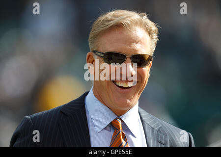 Nov 6, 2011; Oakland, CA, USA; Denver Broncos executive vice president for football operations John Elway on the sidelines before the game against the Oakland Raiders at O.co Coliseum. Denver defeated Oakland 38-24. Stock Photo