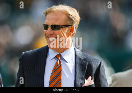 Nov 6, 2011; Oakland, CA, USA; Denver Broncos executive vice president for football operations John Elway on the sidelines before the game against the Oakland Raiders at O.co Coliseum. Stock Photo