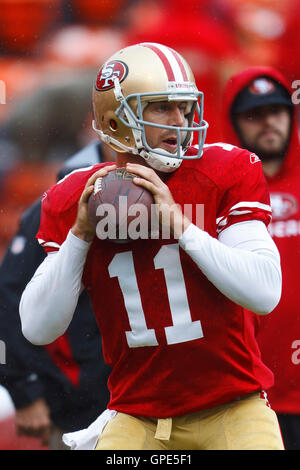 Nov 20, 2011; San Francisco, CA, USA; San Francisco 49ers quarterback Alex Smith (11) warms up before the game against the Arizona Cardinals at Candlestick Park. Stock Photo