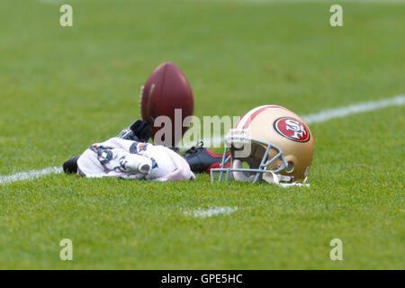 Nov 20, 2011; San Francisco, CA, USA; Detailed view of a San Francisco 49ers helmet and a football on a kicking tee before the game against the Arizona Cardinals at Candlestick Park. San Francisco defeated Arizona 23-7. Stock Photo