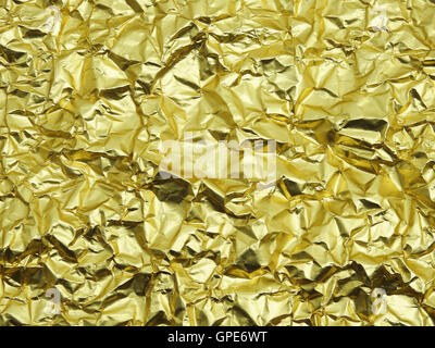 Monotone texture of the golden foil. Stock Photo