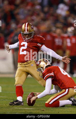 Dec 19, 2011; San Francisco, CA, USA; San Francisco 49ers kicker David Akers (2) kicks a field goal off the hold from punter Andy Lee (4) during the second quarter against the Pittsburgh Steelers at Candlestick Park. Stock Photo
