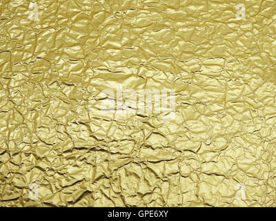 Monotone texture of the golden foil. Stock Photo