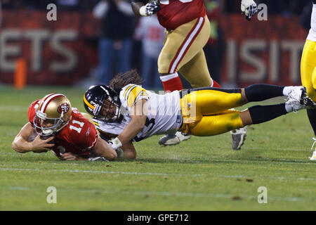 Pittsburgh Steelers Strong Safety Troy Polamalu (43) tackles Miami Dolphins  Tight End Randy McMichael (81) during a second quarter downpour on  September 26, 2004 at Pro Player Stadium in Miami, Fl. The