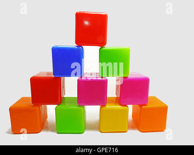 Pyramid built from colored children's blocks. Stock Photo