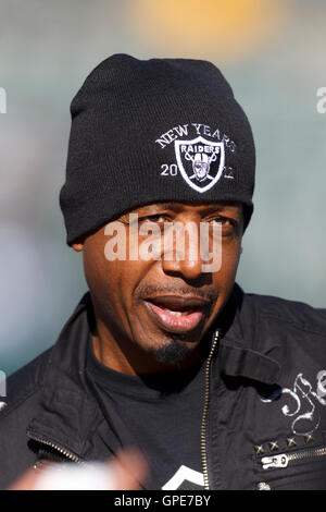Jan 1, 2012; Oakland, CA, USA; Recording artist M.C. Hammer on the sidelines before the game between the Oakland Raiders and the San Diego Chargers at O.co Coliseum. Stock Photo