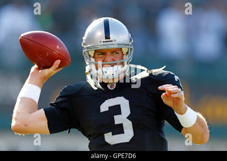 Jan 1, 2012; Oakland, CA, USA; Oakland Raiders quarterback Carson Palmer (3) warms up before the game against the San Diego Chargers at O.co Coliseum. Stock Photo