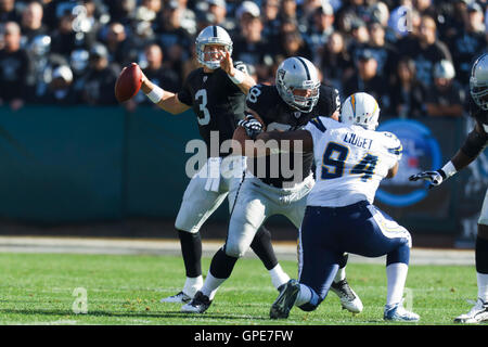 Jan 1, 2012; Oakland, CA, USA; Oakland Raiders quarterback Carson Palmer (3) passes the ball against the San Diego Chargers during the first quarter at O.co Coliseum. Stock Photo