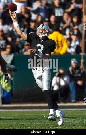 Jan 1, 2012; Oakland, CA, USA; Oakland Raiders quarterback Carson Palmer (3) passes the ball against the San Diego Chargers during the second quarter at O.co Coliseum. Stock Photo