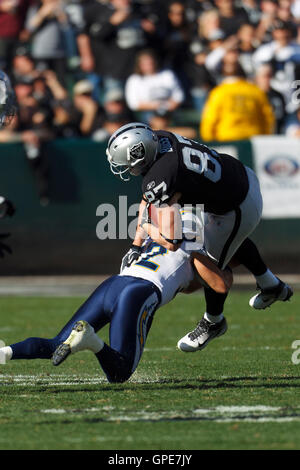 Oakland Raiders Javon Walker (84) eludes San Diego Chargers Eric Weddle  (32) after taking a JaMarcus Russell pass at the Coliseum in Oakland,  California on September 28, 2008. The Chargers defeated the