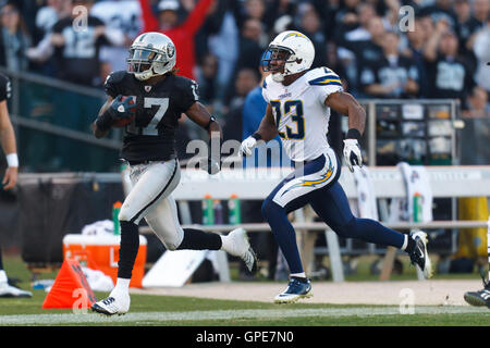 San Diego Chargers' Quentin Jammer intercepts a pass intended for Seattle  Seahawks' Mike Williams (17) as Chargers' Eric Weddle looks on in the first  half of an NFL football game, Sunday, Sept.