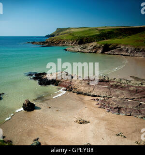 A picturesque bay near the popular surfing beach of Polzeath on the north coast of Cornwall in England. Stock Photo
