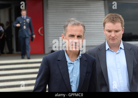 Governor of Bank of England Mark Carney (left) at Heathrow Airport as Prime Minister Theresa May (not pictured) boards a plane for the G20 Summit in Hangzhou in China which begins on Sunday. Stock Photo
