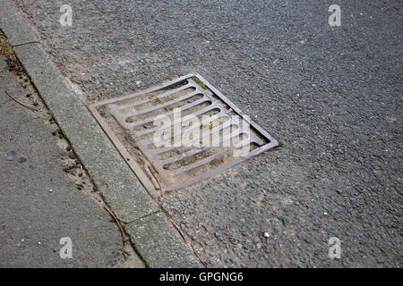 Drains blocked by leaves and mud and not cleaned out Stock Photo - Alamy