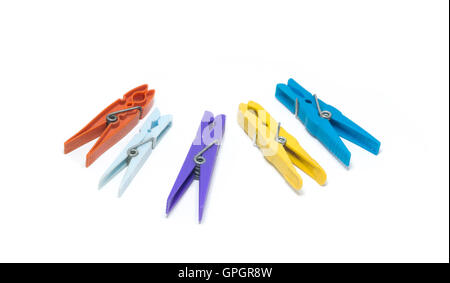 Five plastic, colorful clothespins isolated on white background. Stock Photo