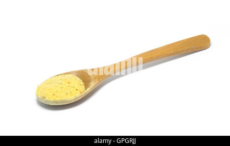 wooden spoon with vegeta spice isolated on white background. Stock Photo