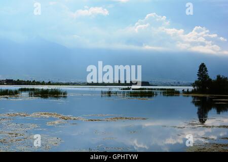 Lake with Cloudy Sky Reflection, at Dali County, Yunnan Province, China. Stock Photo