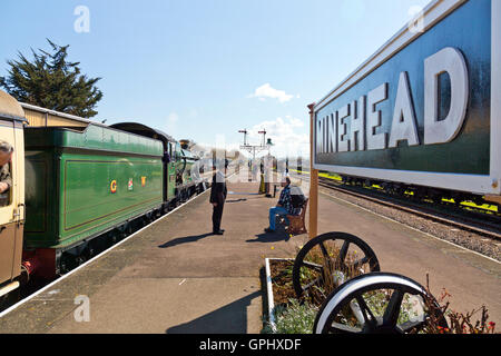 Ex-GWR steam loco 6960 'Raveningham Hall' waiting to depart from Minehead station, West Somerset Railway, England, UK Stock Photo