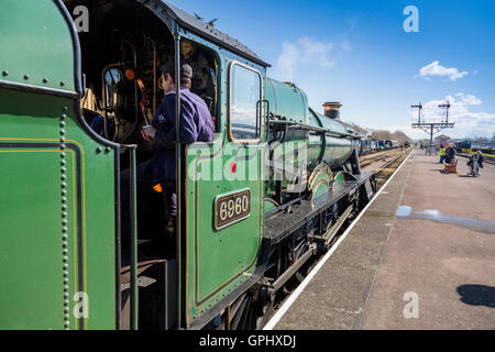 Ex-GWR steam loco 6960 'Raveningham Hall' waiting to depart from Minehead station, West Somerset Railway, England, UK Stock Photo