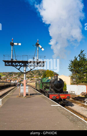 Ex-GWR steam loco 6960 'Raveningham Hall' departing from Minehead station, West Somerset Railway, England, UK Stock Photo