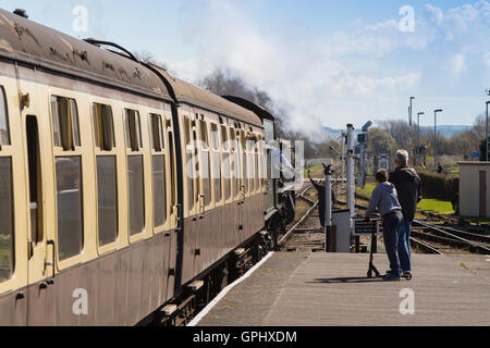 Ex-GWR steam loco 6960 'Raveningham Hall' collecting a single line token at Minehead station, West Somerset Rly, England, UK Stock Photo