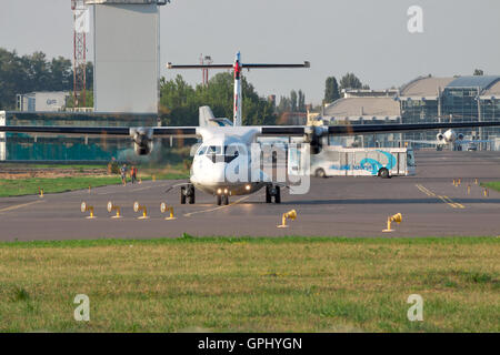 Kiev, Ukraine - July 27, 2012: ATR-72 regional plane front view at the airport taxiing to runway Stock Photo