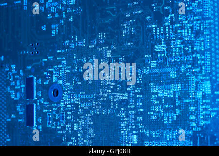 full frame blue illuminated printed circuit board closeup Stock Photo