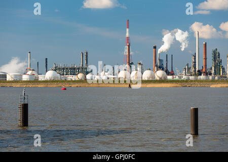 A large refinery with gas storage tanks in the port of Antwerp, Belgium with lots of distillation towers. Stock Photo