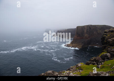 Rugged and dramatic Eshaness coastline on the north west Shetland coast on a wild and misty day Stock Photo