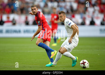 England's Jordan Henderson (left) and Slovakia's Jan Durica battle for the ball during the 2018 FIFA World Cup Qualifying match at the City Arena, Trnava. Stock Photo