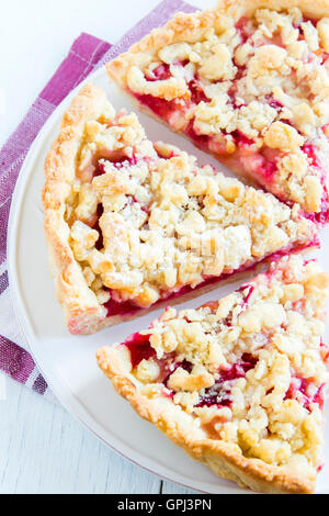 Homemade shortcrust cherry cake (pie) with crumble on white background Stock Photo