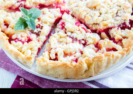 Homemade shortcrust cherry cake (pie) with crumble on white background Stock Photo