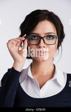 Young attractive happy woman trying on new glasses Stock Photo