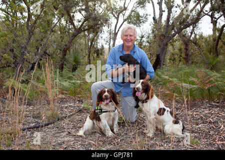 Dog trainer, Steve Austin with feral animal detection dog, Bolt. Black Rock National Park, NSW, Australia Stock Photo