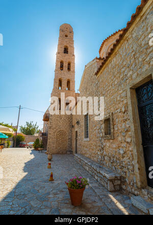 Traditional white bell tower against a blue sky at Areopolis town in Lakonia, Greece Stock Photo