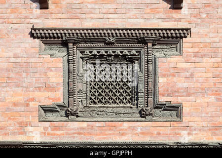 Beautifully carved wooden window  at the royal palace, Durbar square, Patan, Nepal Stock Photo