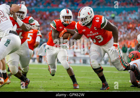 Miami offensive lineman Danny Isidora runs a drill at the NFL football ...