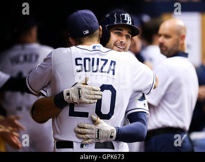 Hak-Ju Lee of the Tampa Bay Rays singles to center field scoring