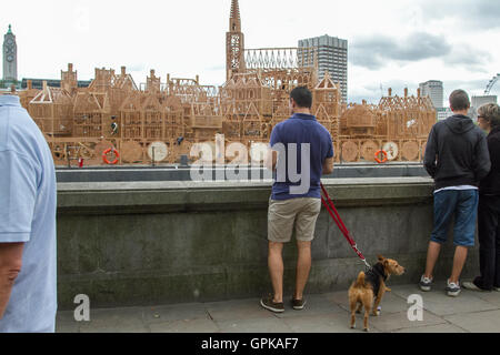 London UK. 4th September 2016. Crowds view the replica wooden sculpture by David  Best before the official ceremony commemorating the Great Fire of London in 1666 Credit:  amer ghazzal/Alamy Live News Stock Photo