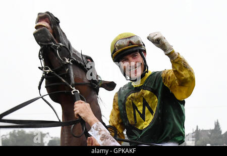 Iffezheim, Germany. 4th Sep, 2016. Jockey Ian Ferguson and his horse Iquitos winning the 144th Grand Prix of Baden at the 'Grosse Woche' equestrian event at the gallop race track in Iffezheim, Germany, 4 September 2016. PHOTO: ULI DECK/dpa/Alamy Live News Stock Photo