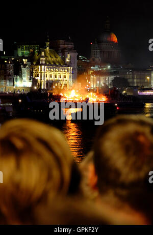 London, UK. 4th September, 2016. Great Fire of London: London 4th September 2016. Crowds of people watch on as a wooden model of 17th century London is set ablaze on the Thames to mark the 350th anniversary of the Great Fire of London. (c) Paul Swinney/Alamy Live News Stock Photo