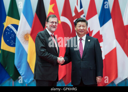 Hangzhou, China. 04th Sep, 2016. Spanish Prime Minister Mariano Rajoy is greeted by Chinese President Xi Jinping (r) at the G20 Summit in Hangzhou, China, 04 September 2016. The group of the 19 leading industrialized and emerging countries, as well as the European Union (G20), are meeting on 04 and 05 September 2016 in the eastern Chinese city of Hangzhou. Photo: BERND VON JUTRCZENKA/dpa/Alamy Live News Stock Photo