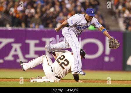 June 29, 2010; San Francisco, CA, USA;  Los Angeles Dodgers shortstop Rafael Furcal (15) completes a double play over San Francisco Giants catcher Eli Whiteside (22) during the seventh inning at AT&T Park. Stock Photo