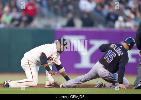 July 15, 2010; San Francisco, CA, USA;  New York Mets center fielder Carlos Beltran (15) is caught stealing second base by San Francisco Giants shortstop Juan Uribe (5) during the fourth inning at AT&T Park. Stock Photo